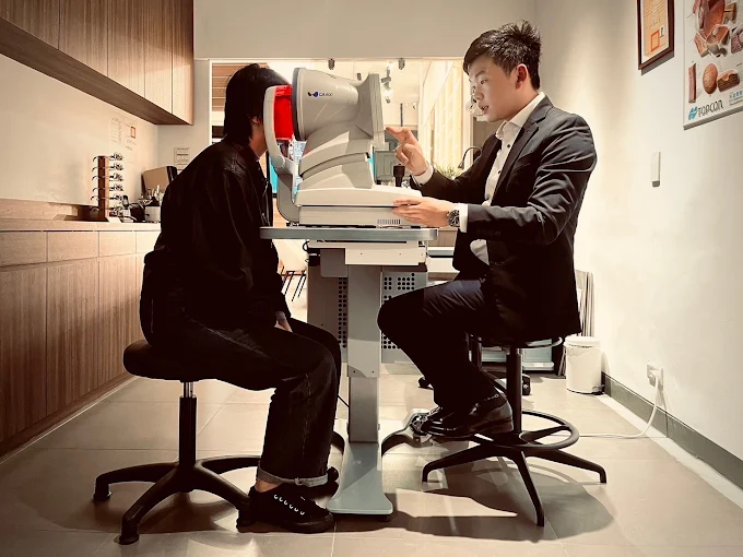 YoYo conducting a full clinical eye examination